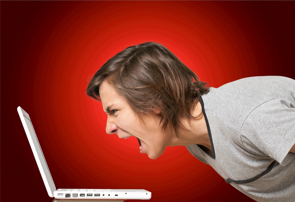 Actuary shouting at a laptop